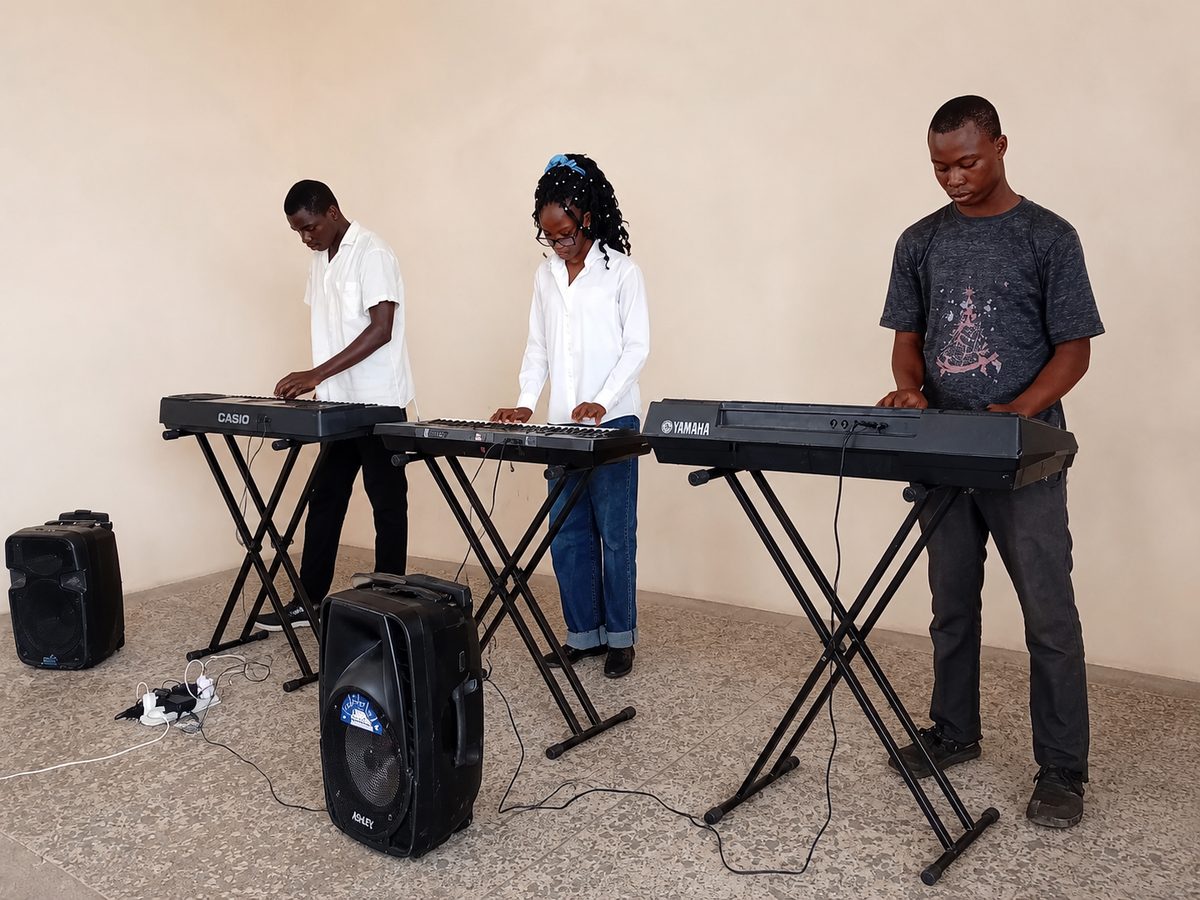 Keyworld Music Institute students playing keyboards